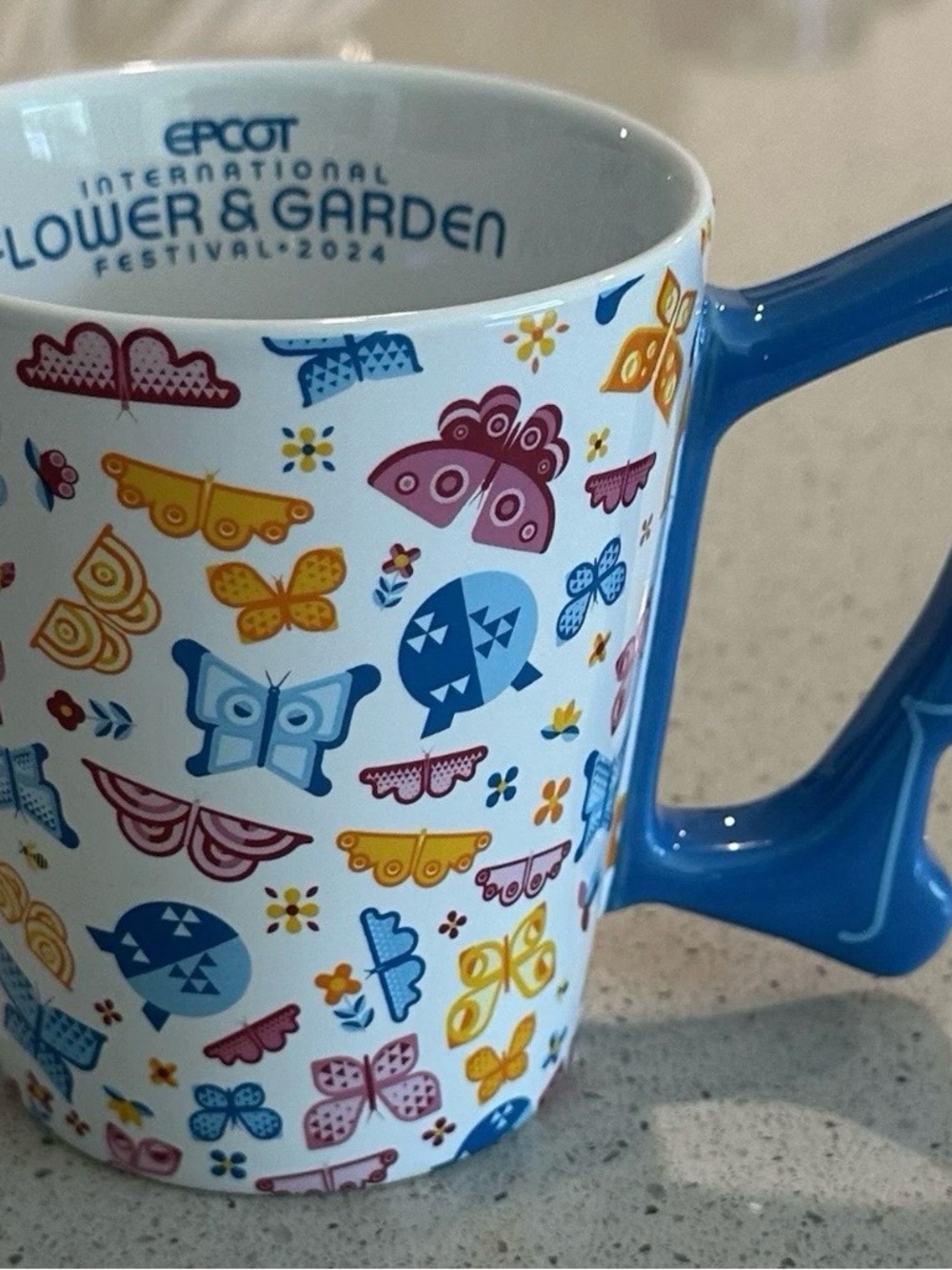Disney Ceramic Mug with Blue Handle and Black Logo